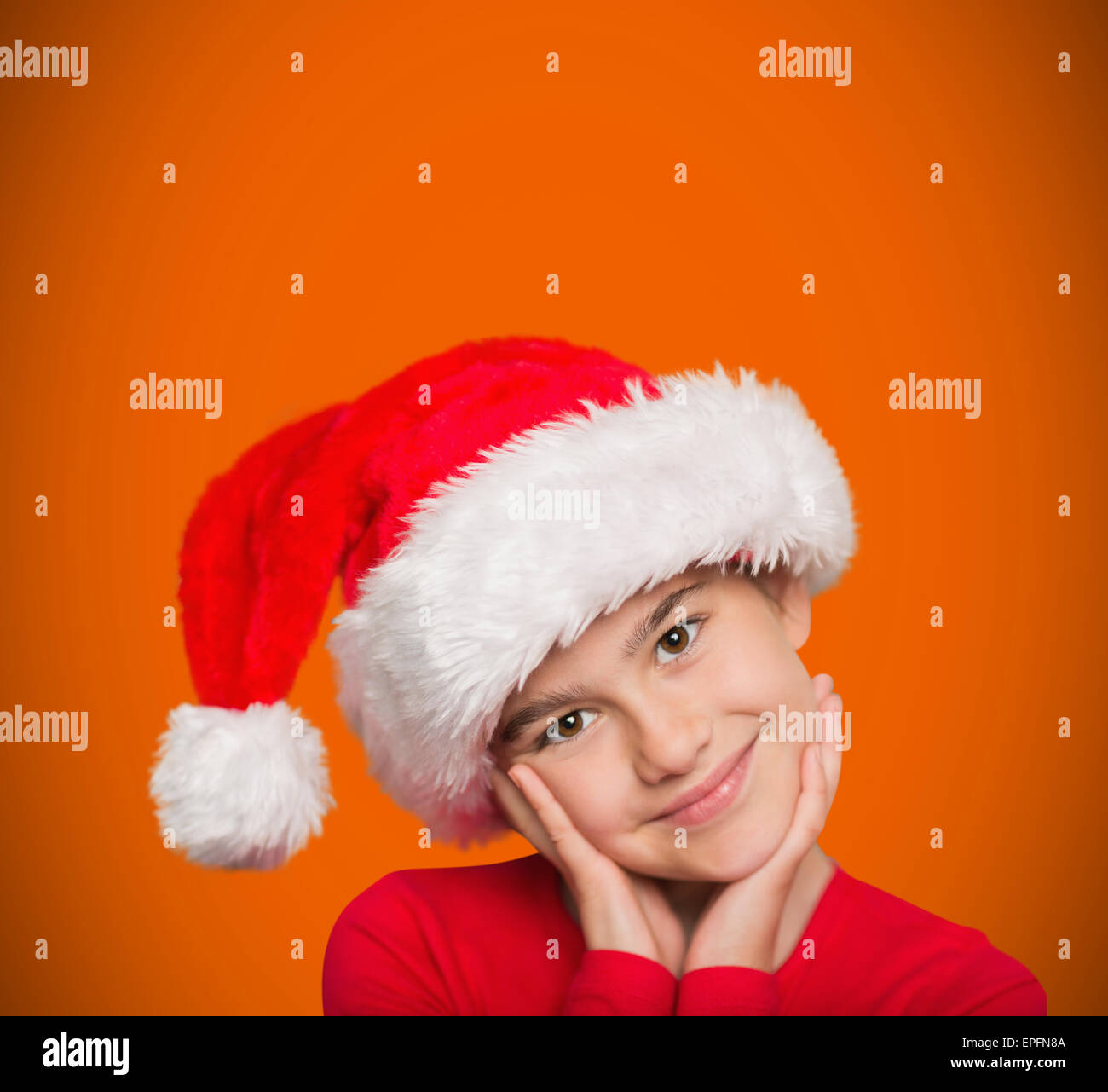 Composite image of festive little girl smiling at camera Stock Photo ...