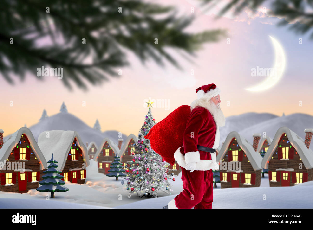 Composite image of santa claus carrying sack Stock Photo - Alamy