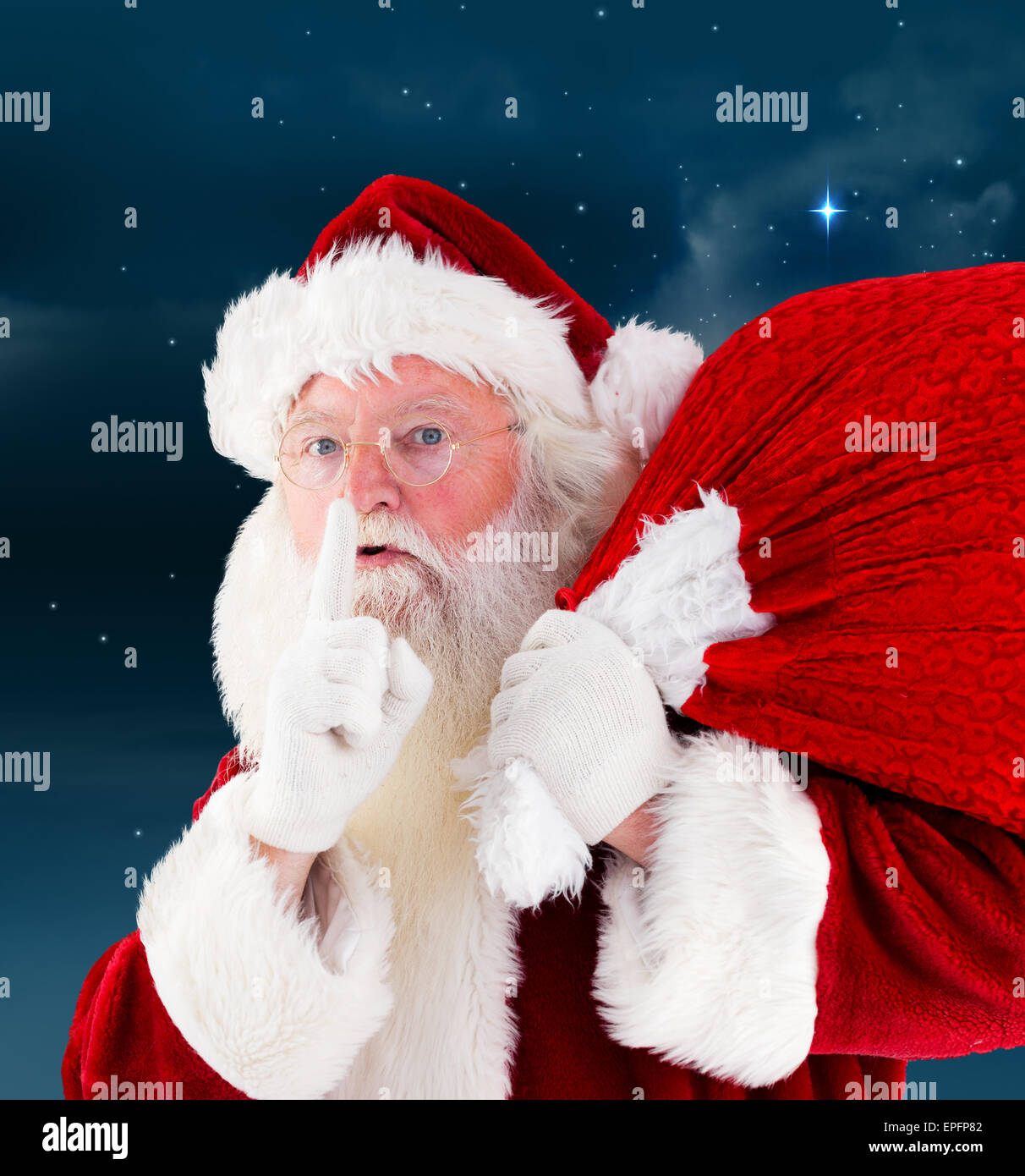 Composite image of santa claus carrying sack Stock Photo - Alamy