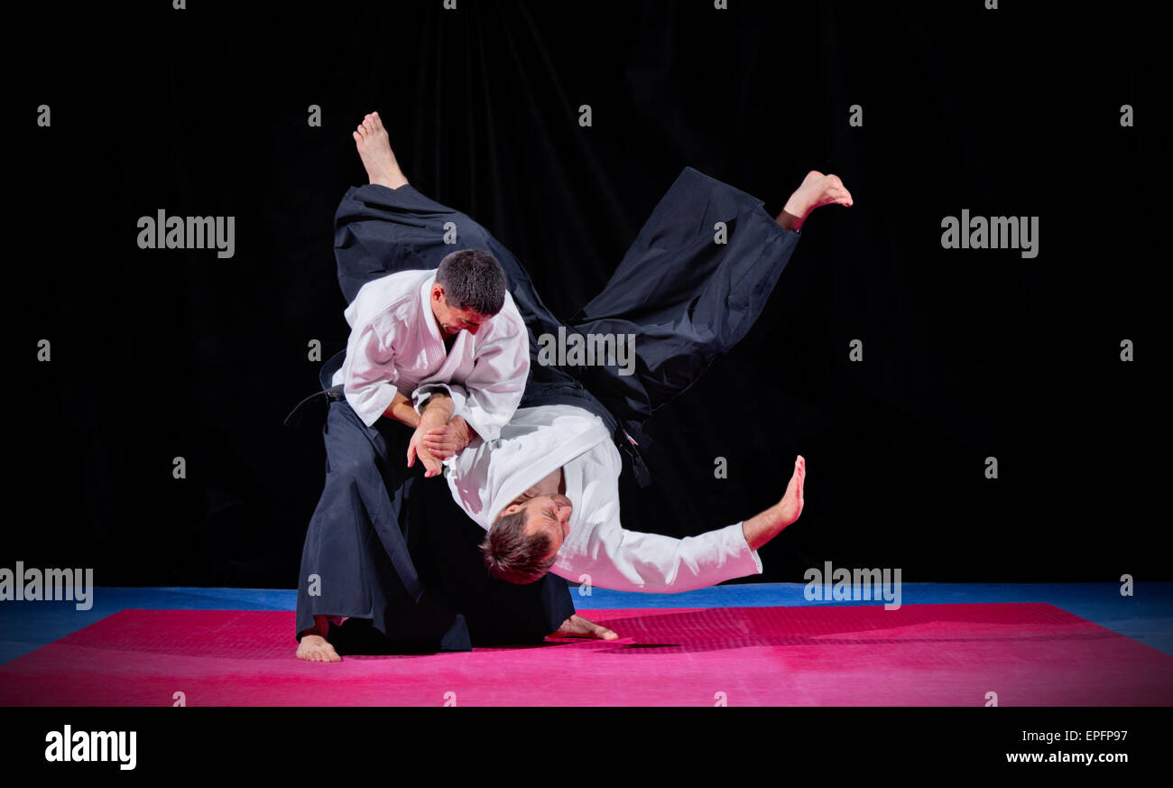 Two martial arts fighters on black Stock Photo