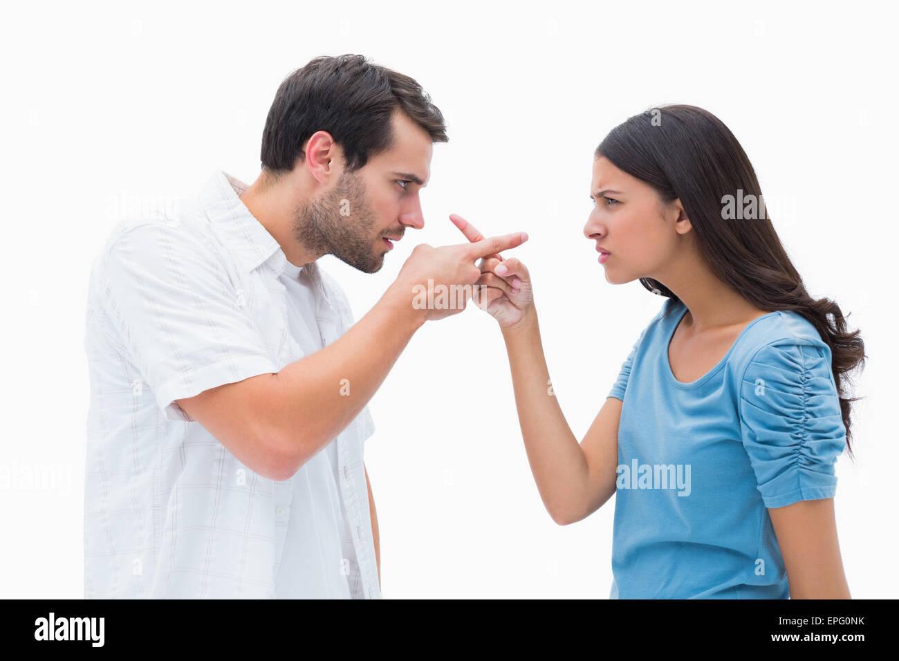 Angry couple pointing at each other Stock Photo