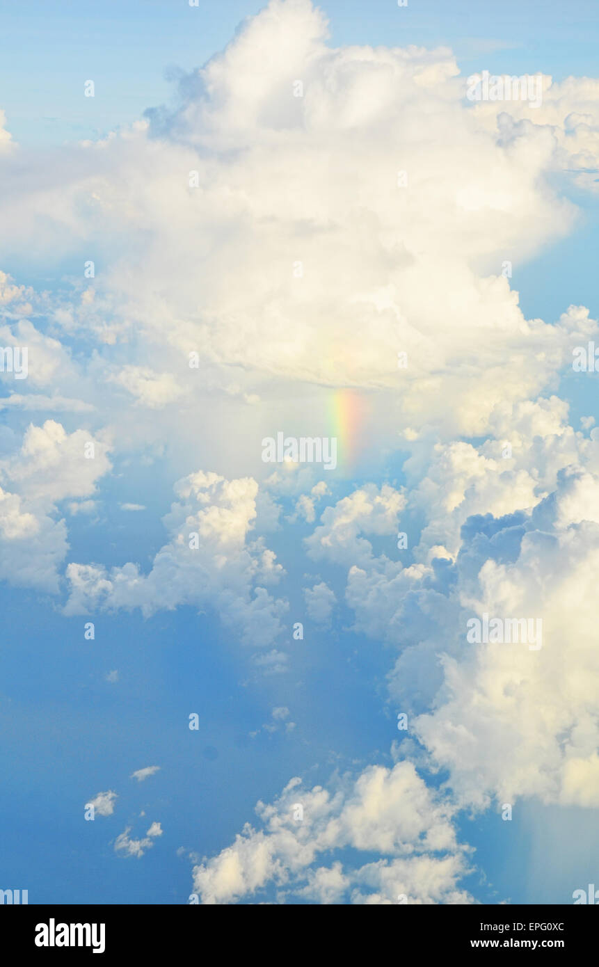Rainbow spotted under the cumulonimbus (rain clouds) above the Sea of Java Stock Photo