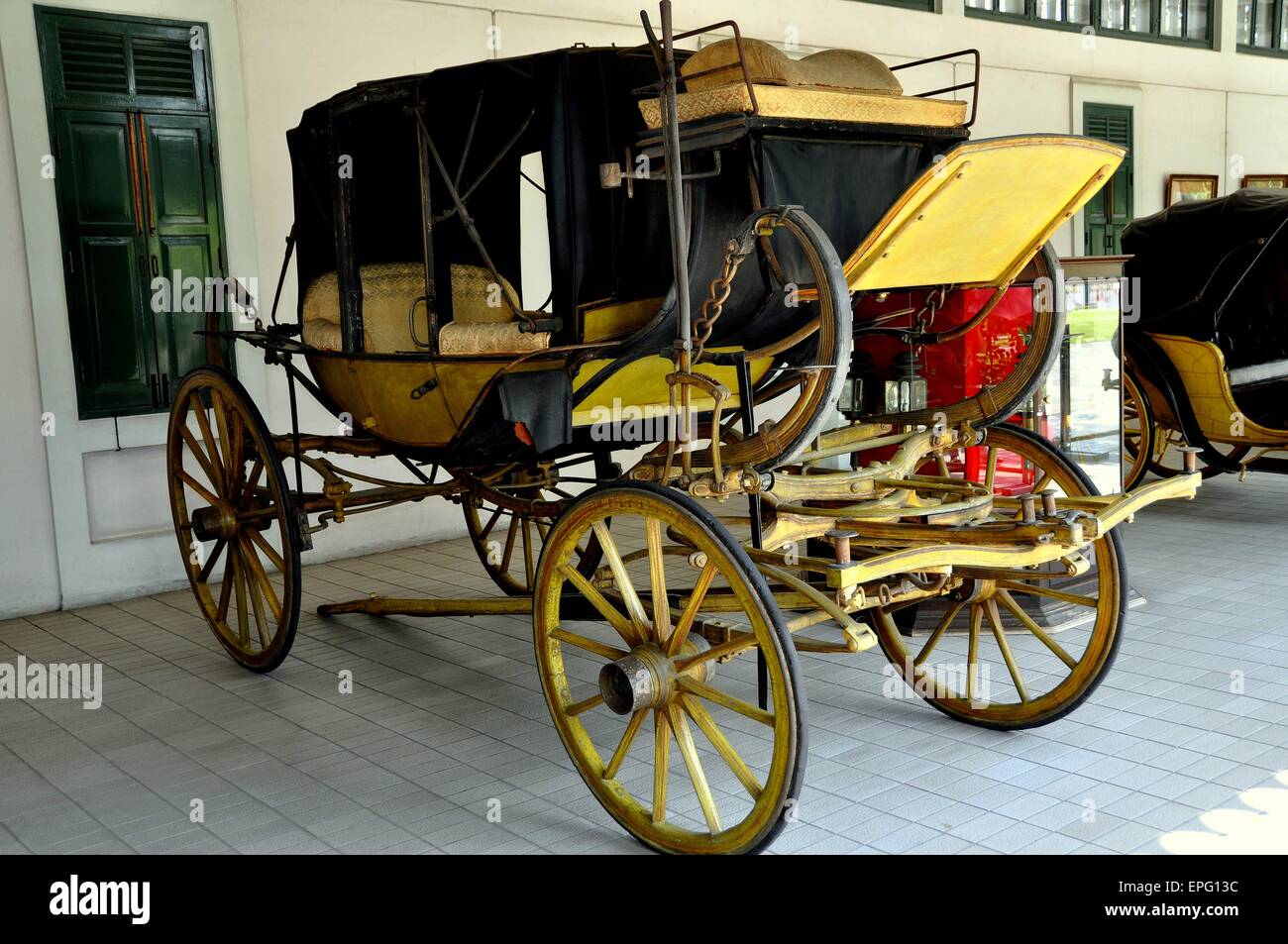 Bangkok, Thailand:  Early 19th century stage coach on display in the Royal Carriage Building No. 3 at the Dusit Royal Palace Stock Photo