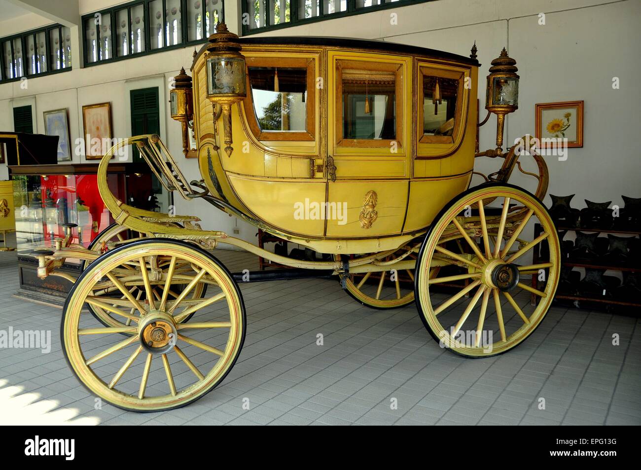 BANGKOK, THAILAND:  A vintage early 19th century stagecoach on display at Royal Carriage Building No. 3 at the Dusit Royal Palac Stock Photo
