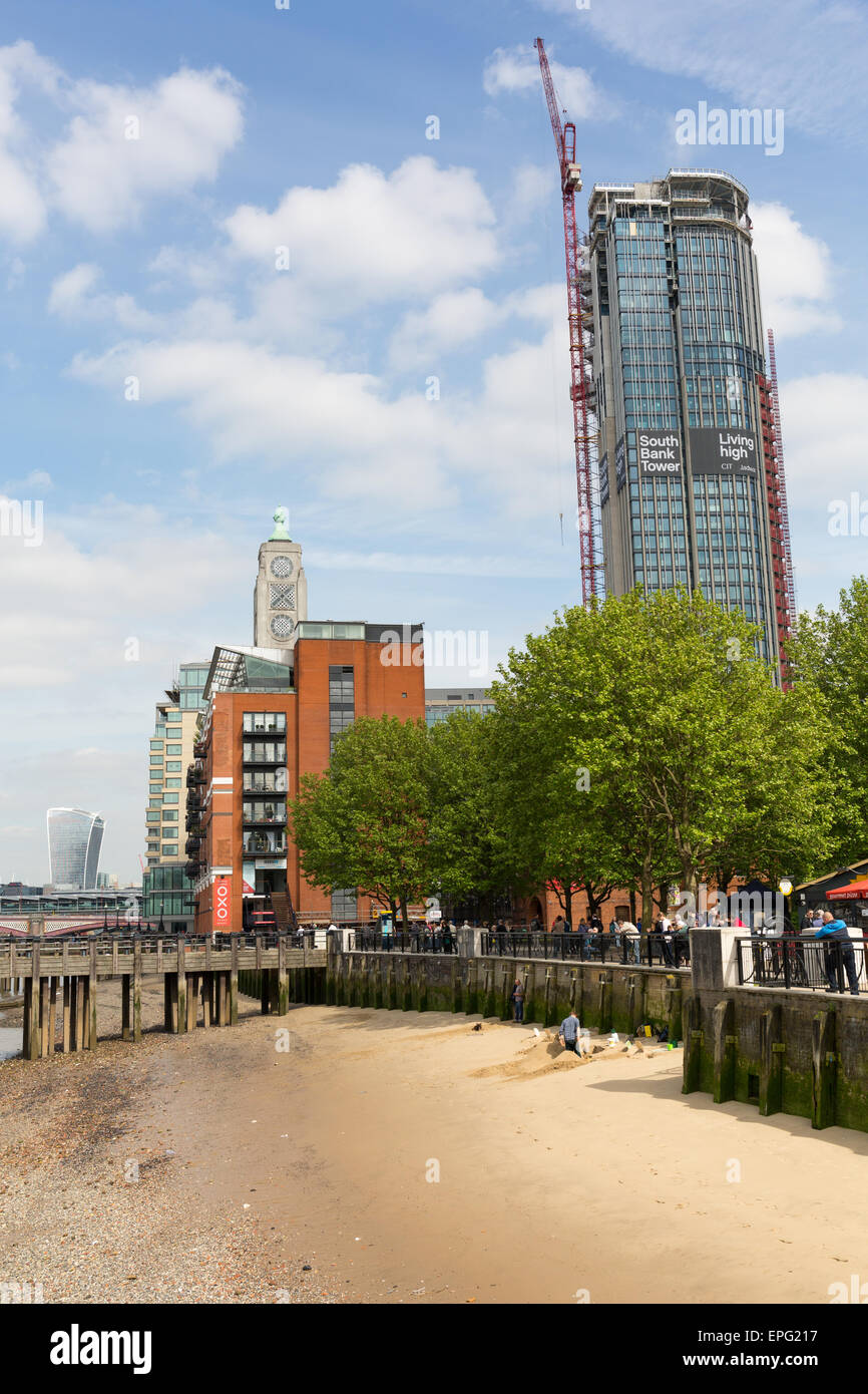 The River Thames foreshore beach outside the OXO tower and South Bank ...