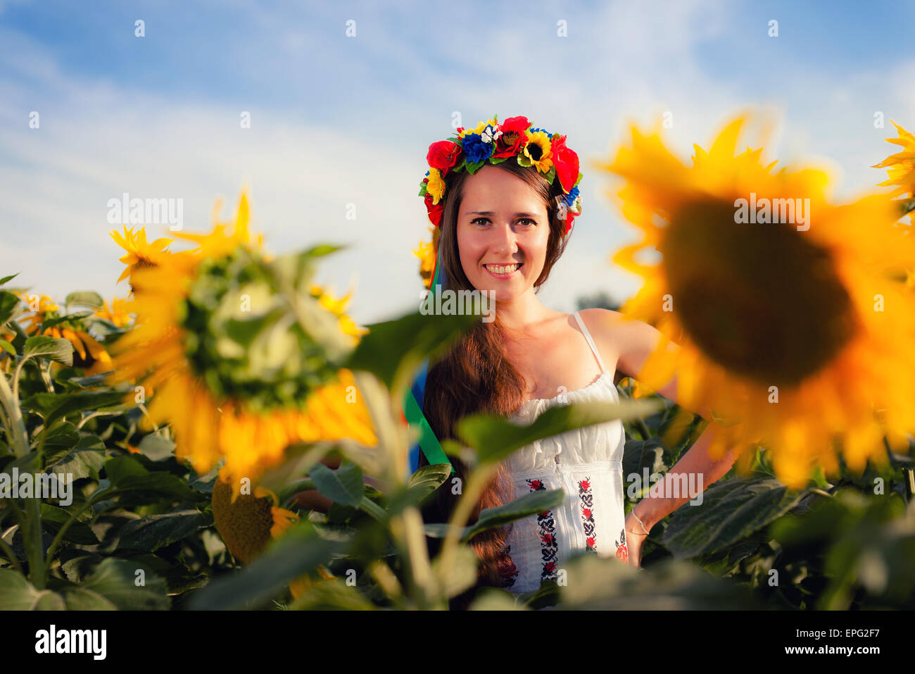 Close-up portrait of beautiful young woman with sunflower Stock Photo ...