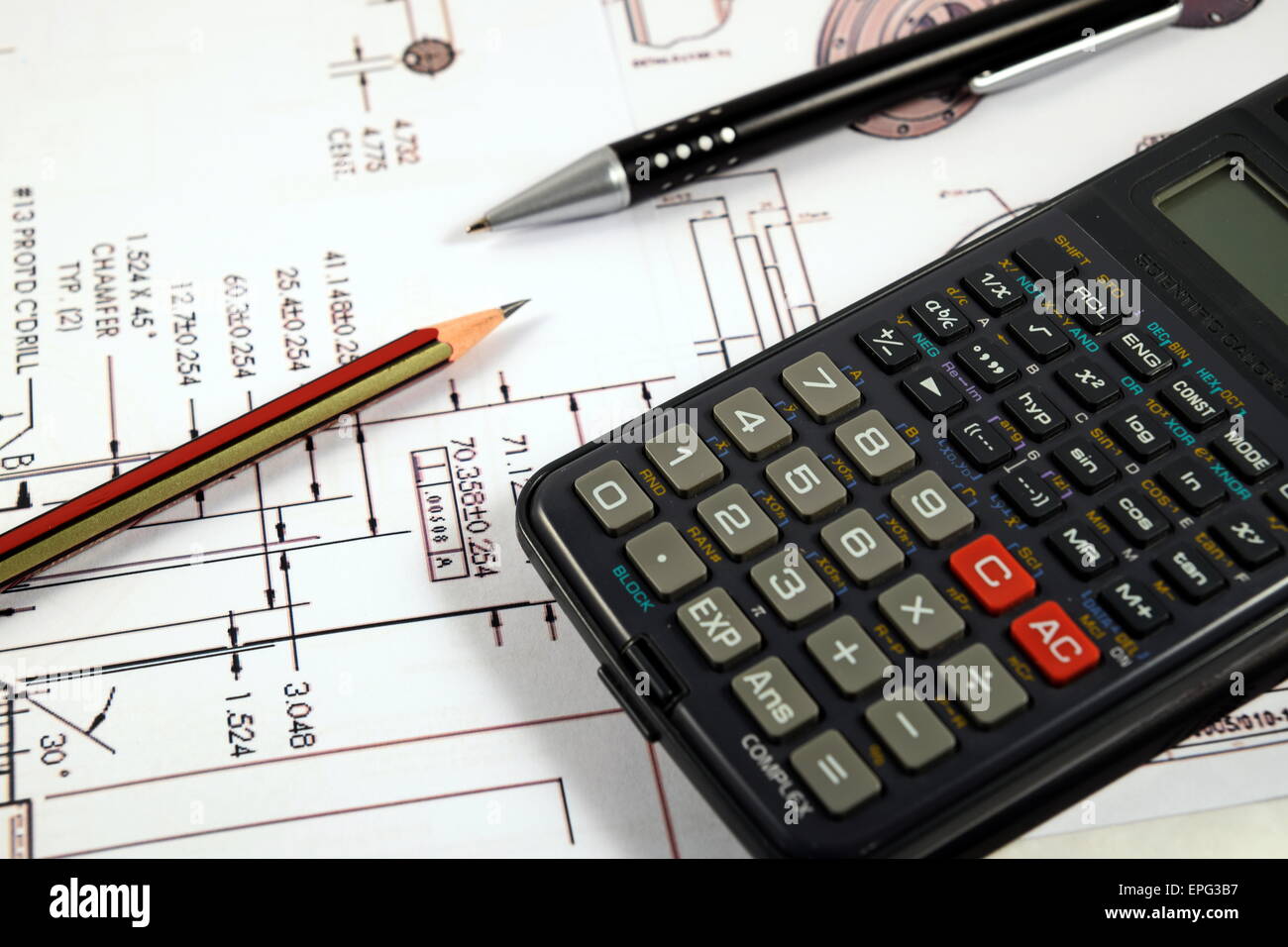 Scientific calculator, Pen and Pencil over the Engineering Drawing Map