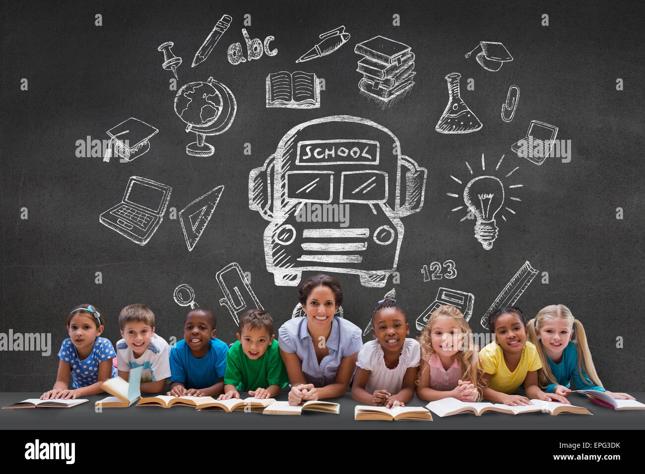 Composite image of cute pupils smiling at camera with teacher Stock ...