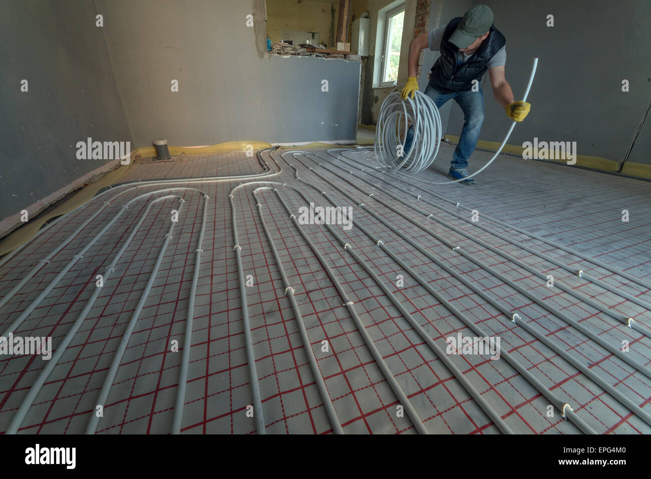 pipefitter installing system of heating Stock Photo
