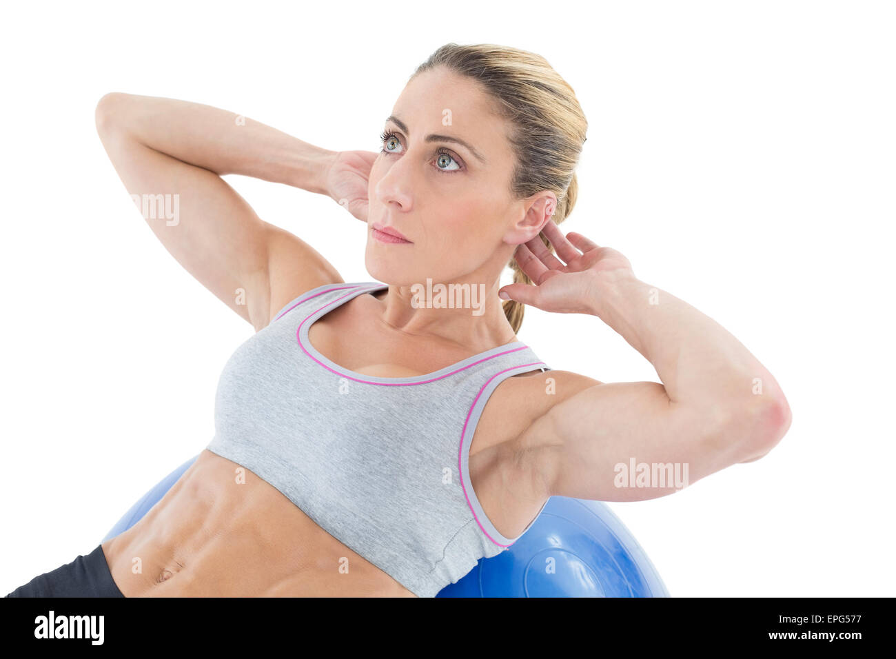Fit woman doing sit ups on blue exercise ball Stock Photo - Alamy