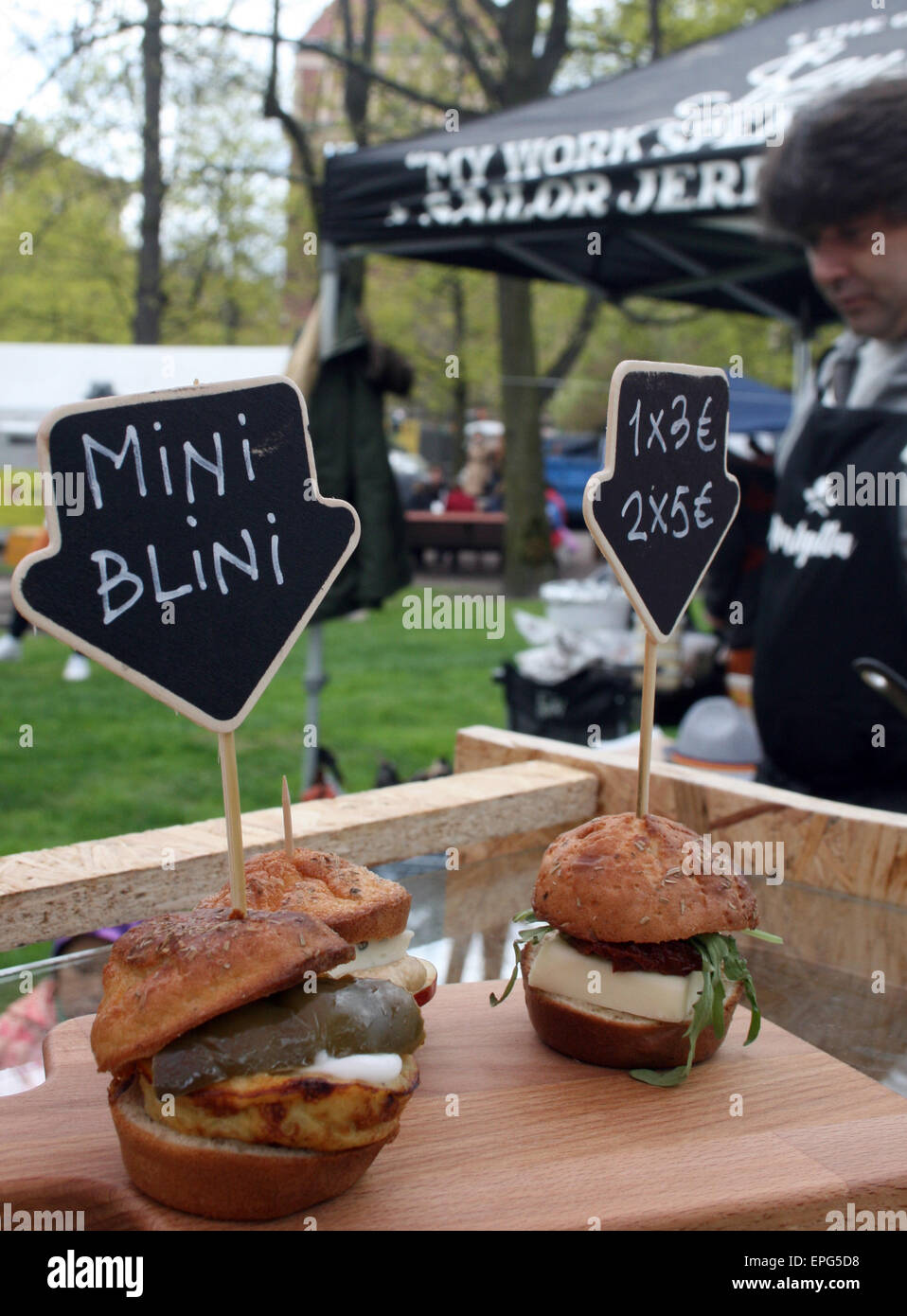 Helsinki, Finland. 16th May, 2015. Antonio Fernandez from Spain offers mini blinis at his food stall during Restaurant Day in Helsinki, Finland, 16 May 2015. Photo: Julia Waeschenbach/dpa/Alamy Live News Stock Photo