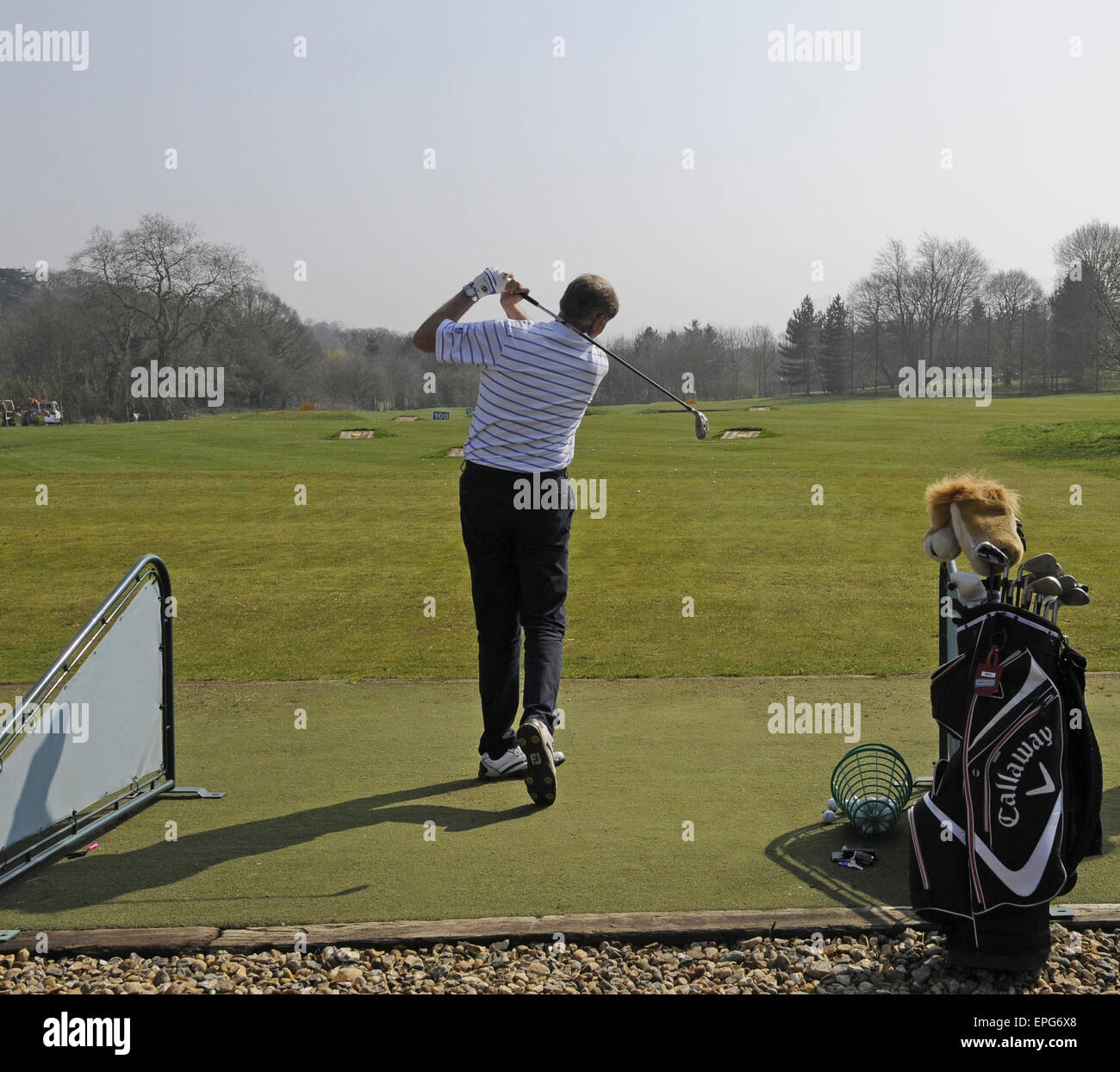 Male Golfer at the Practice Ground at Sundridge Park Golf Club Bromley Kent England Stock Photo