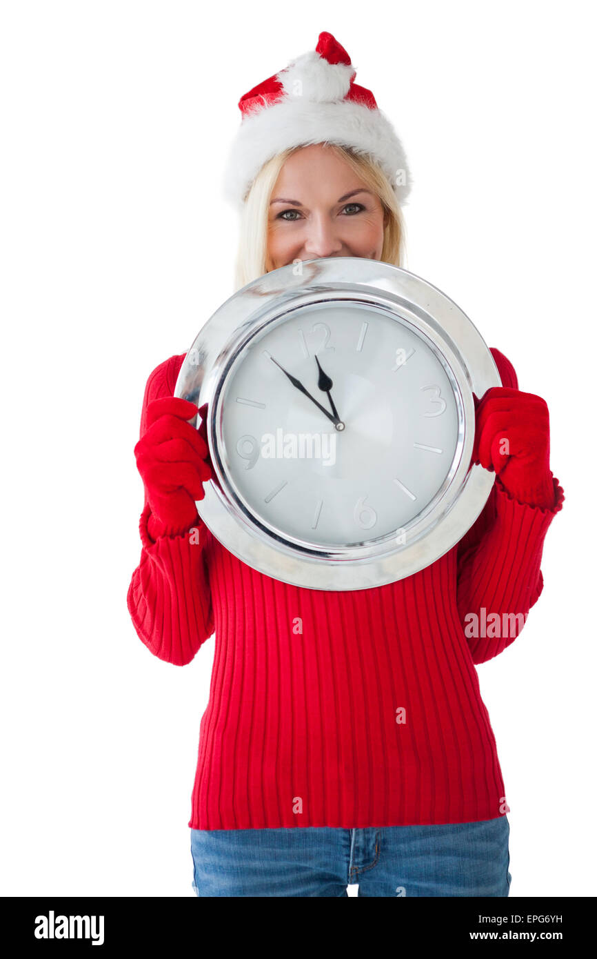 Festive blonde holding large clock Stock Photo