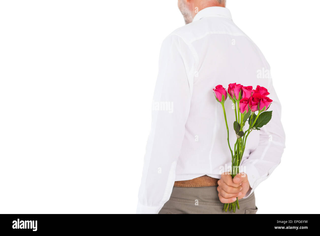 Man holding bouquet of roses behind back Stock Photo - Alamy