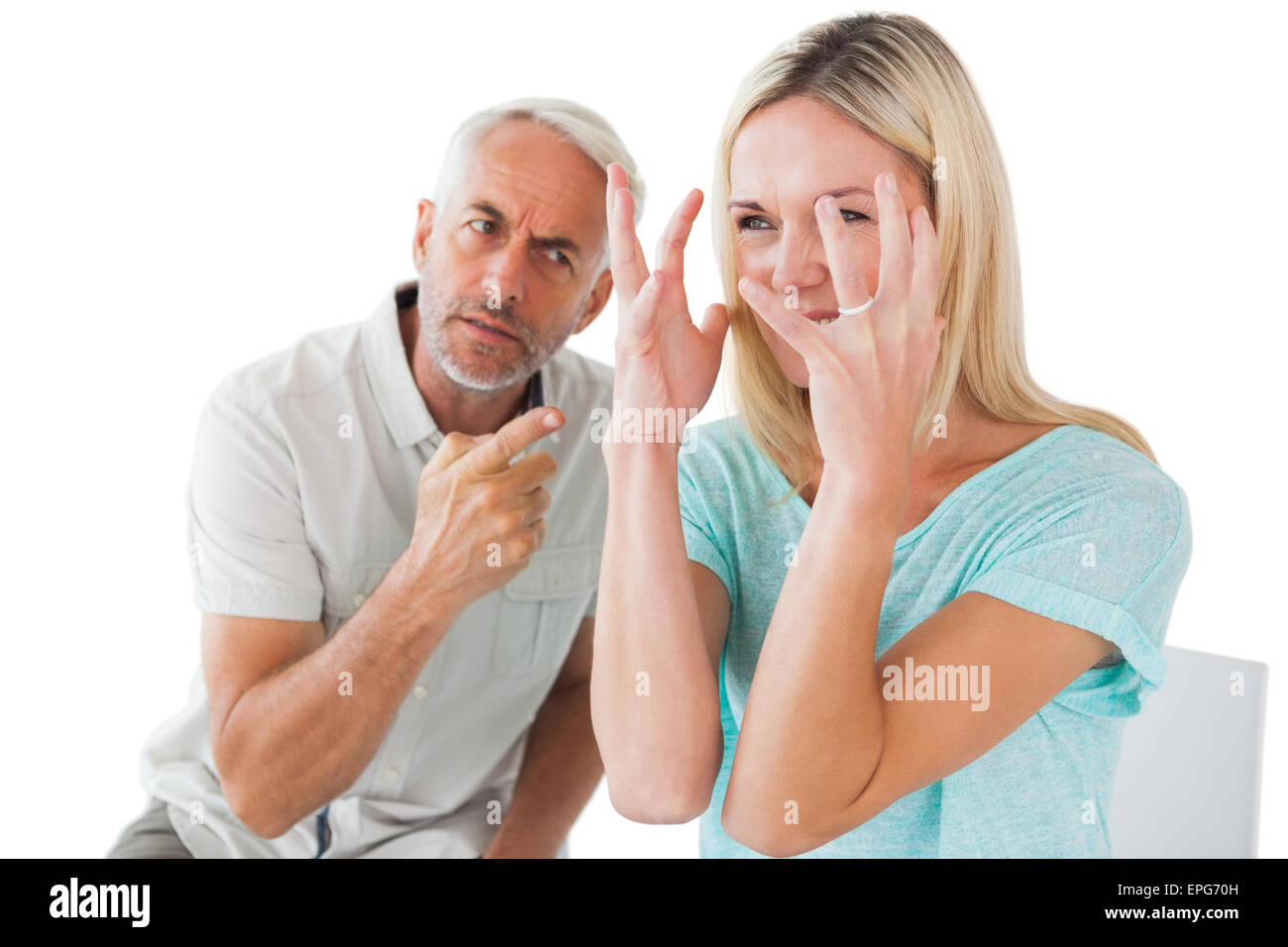 Unhappy couple sitting on chairs having an argument Stock Photo - Alamy