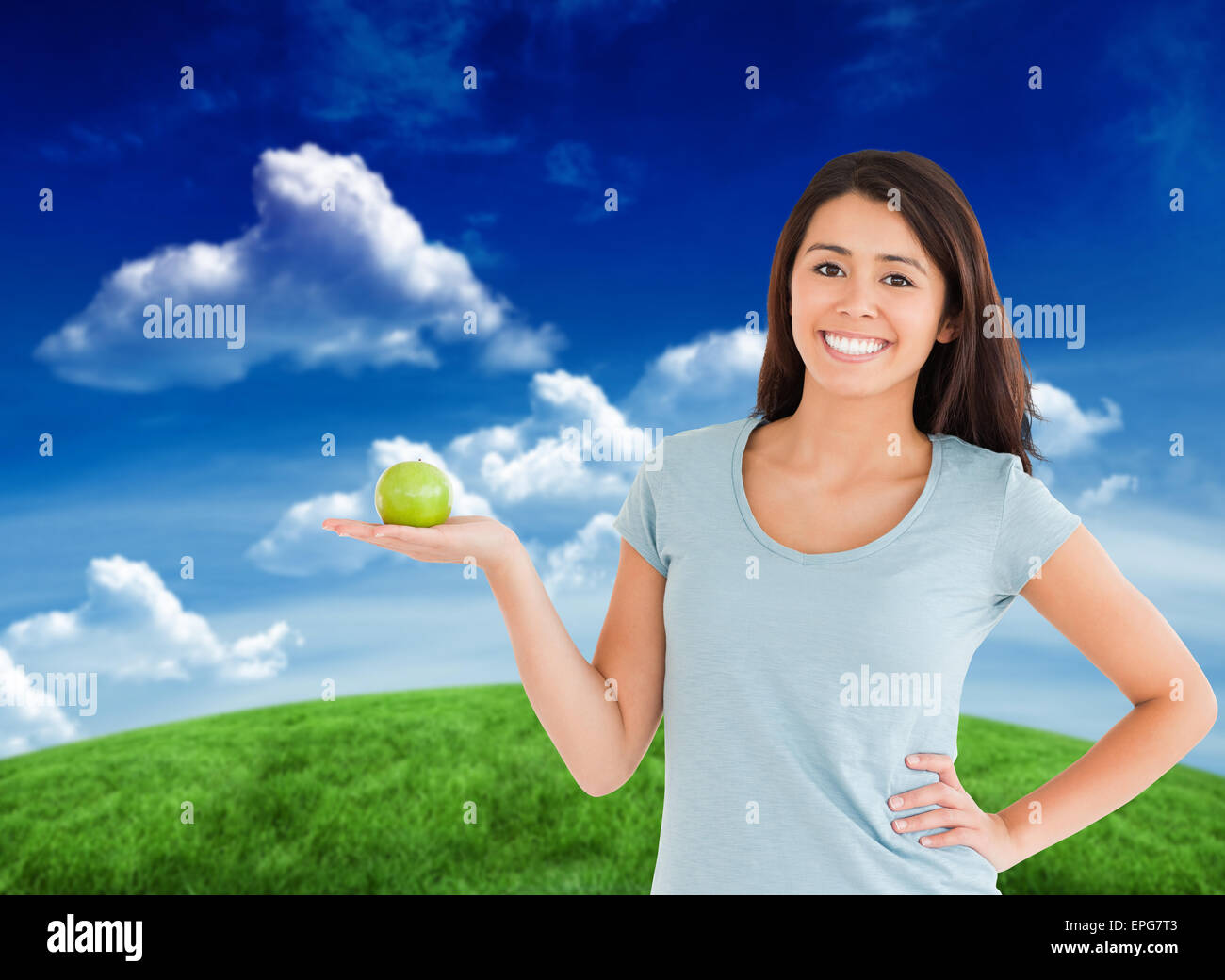 Composite image of smiling student holding textbook Stock Photo - Alamy