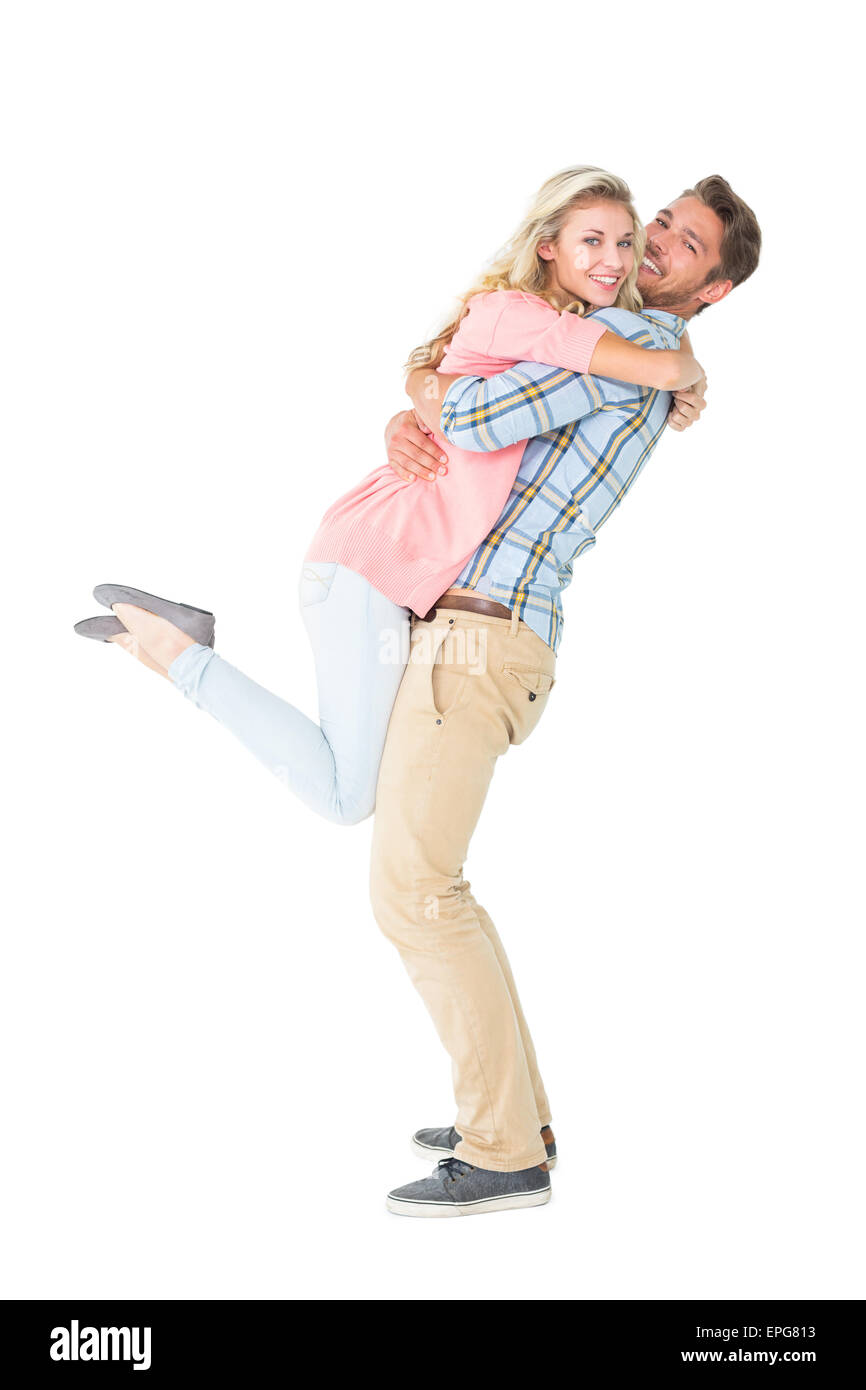 Handsome man picking up and hugging his girlfriend Stock Photo Alamy