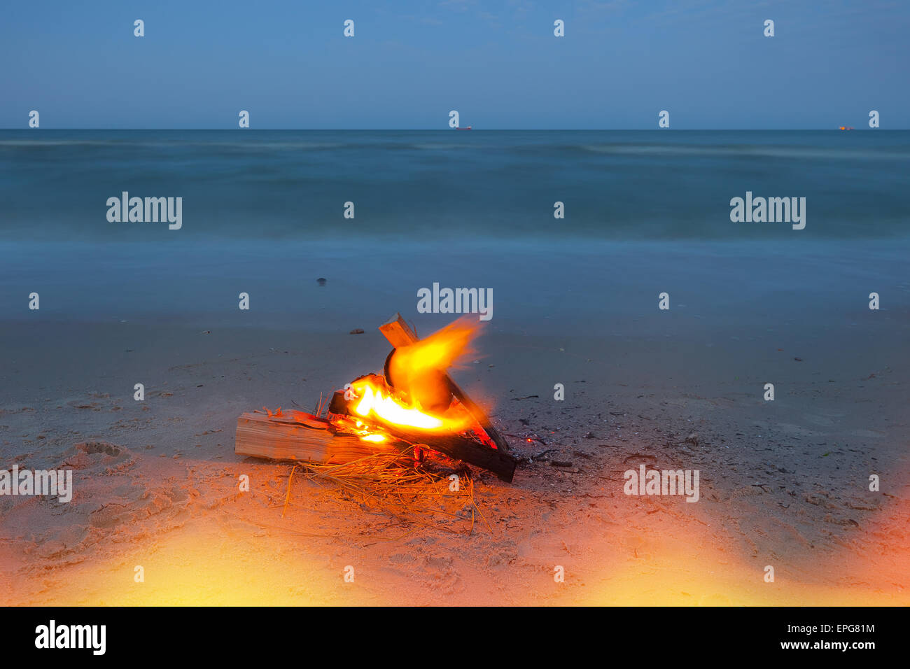 Fire on the beach Stock Photo - Alamy