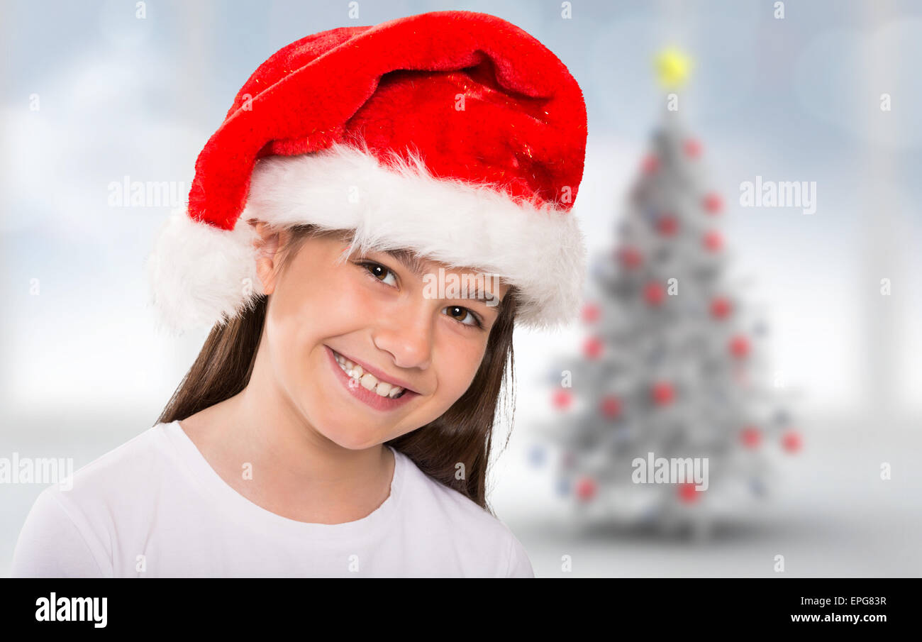 Composite image of festive little girl smiling at camera Stock Photo ...