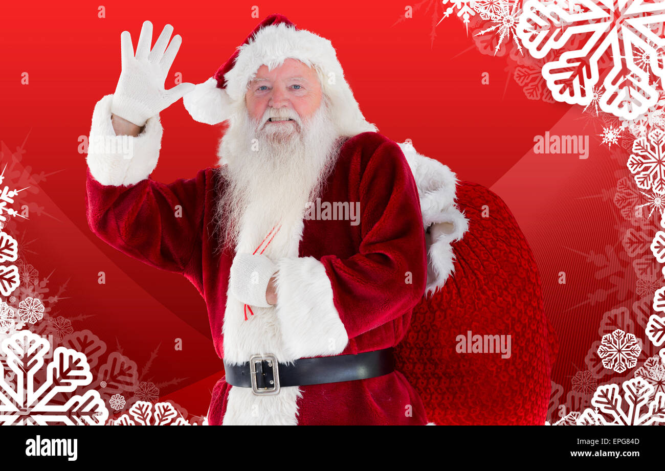 Composite image of santa claus waving Stock Photo - Alamy