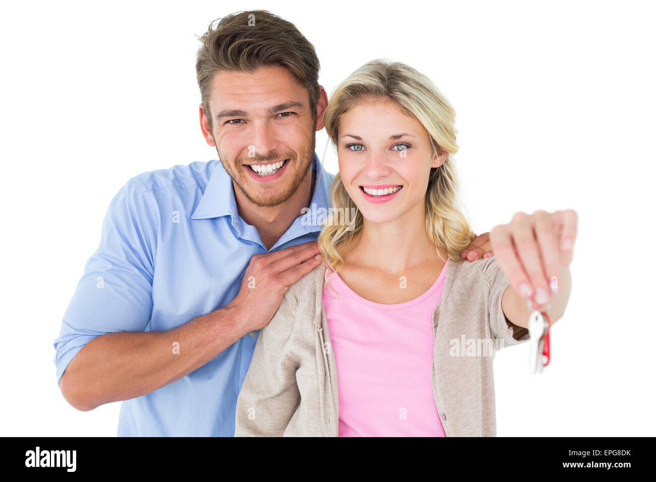 Attractive young couple showing new house key Stock Photo - Alamy