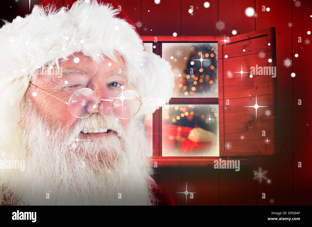 Composite image of santa claus winking Stock Photo - Alamy