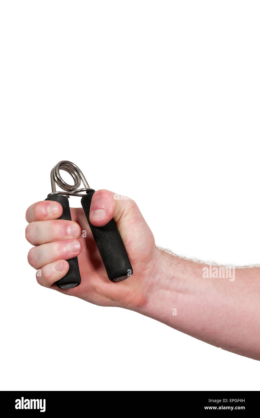 Man with hand grip exerciser Stock Photo