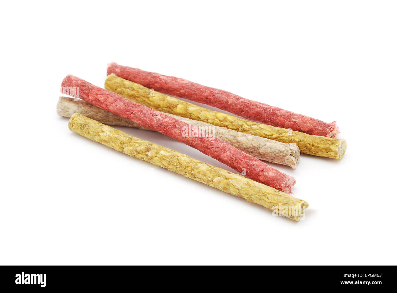 dog chewing sticks on white background Stock Photo Alamy