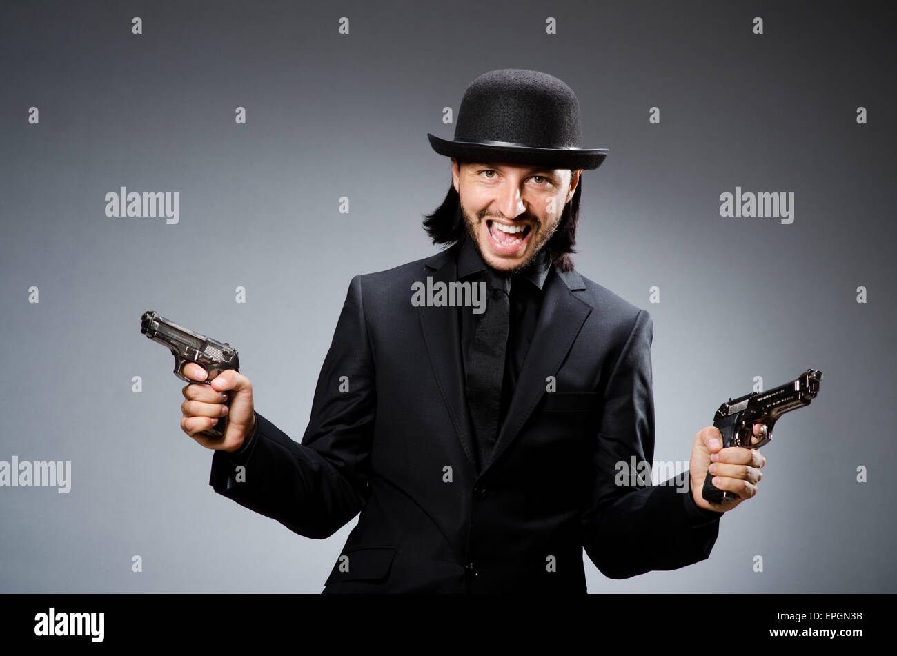 Man wearing vintage hat with gun Stock Photo Alamy
