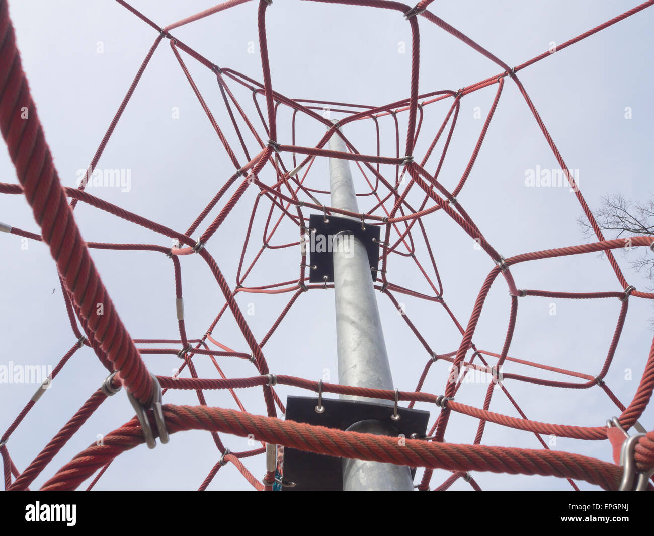 a spidery rope climbing tower apparatus in a Norwegian playground Stock
