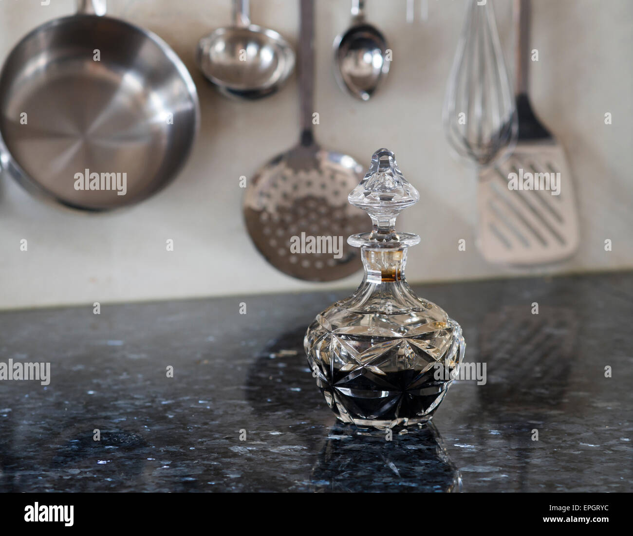 Balsamic Vinegar In A Glass Carafe On A Granite Kitchen Countertop