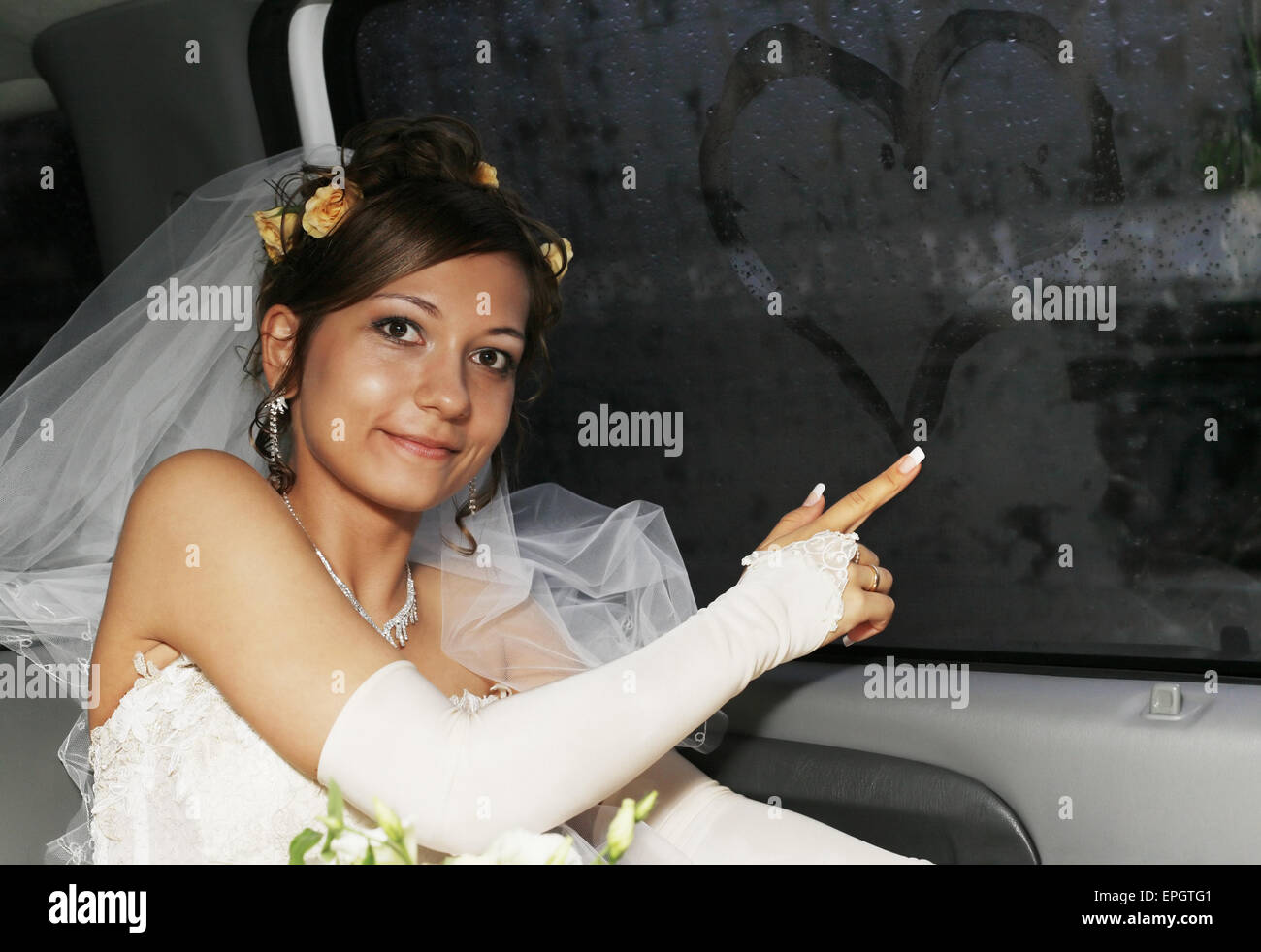 Bride in car Stock Photo - Alamy