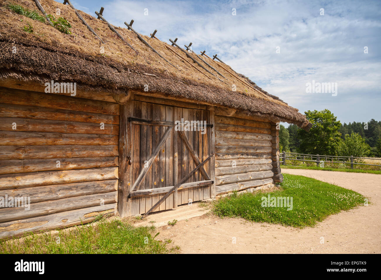 Russian rural wooden architecture example, old barn with locked gate Stock Photo