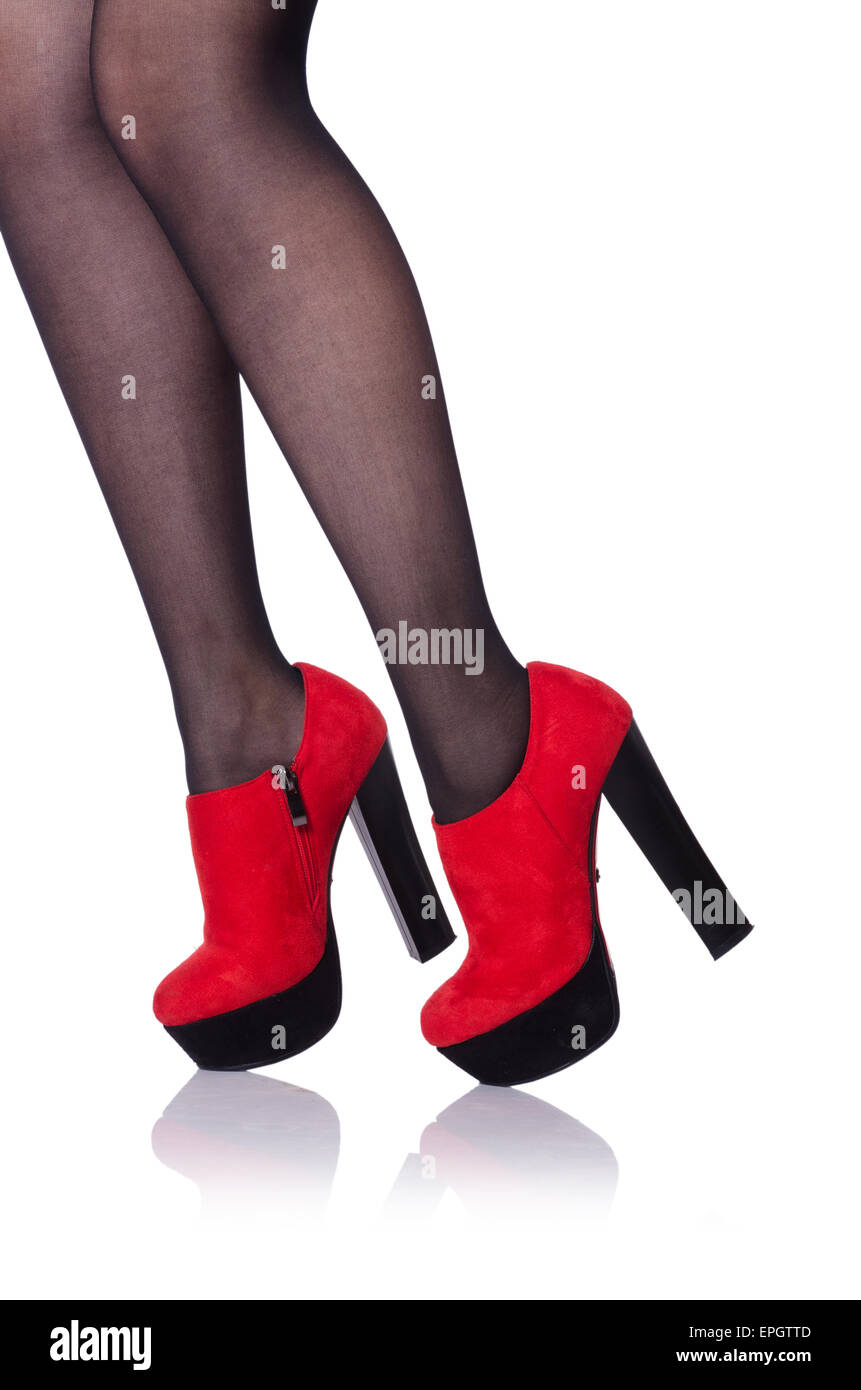 Woman legs with red shoes isolated on the white Stock Photo