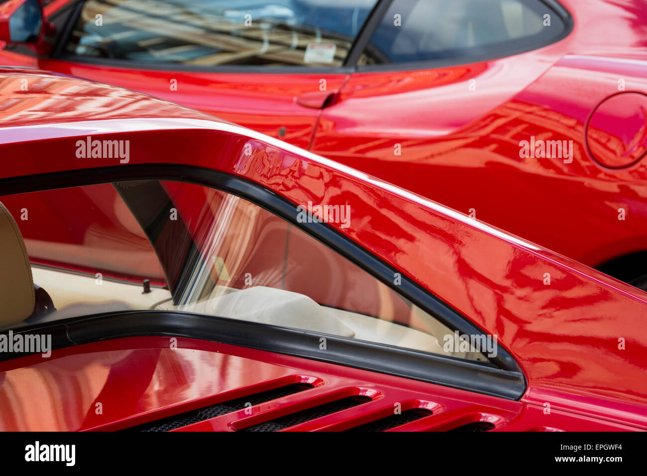 Detail of two red Ferraris at the Bristol Italian Automoto Fair, showing own their curves. Stock Photo