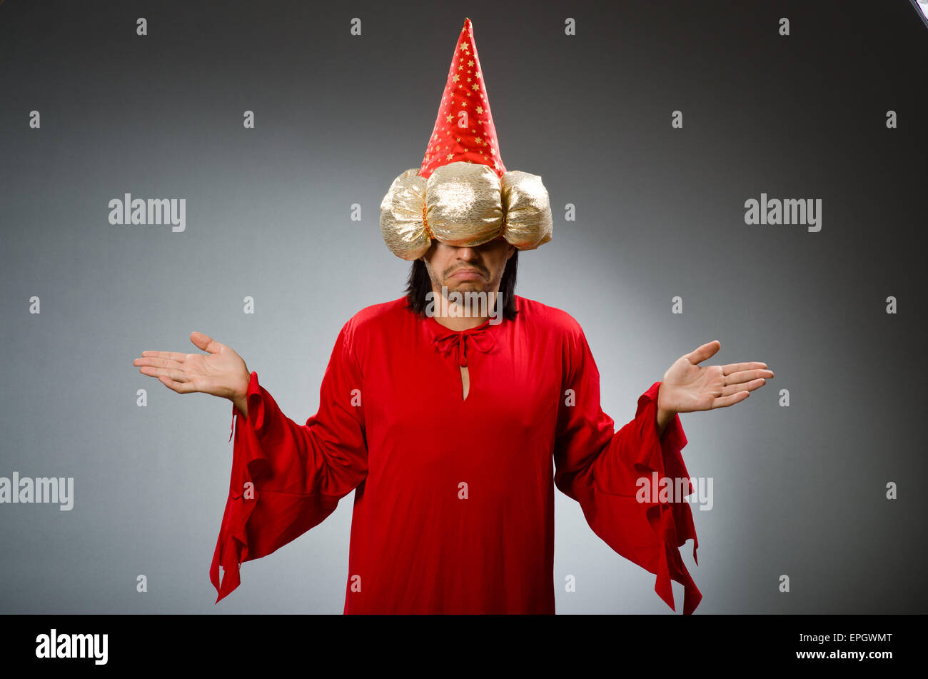 Funny wizard wearing red dress Stock Photo - Alamy