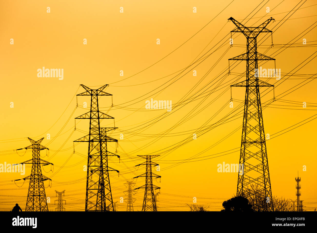 High voltage towers at sunset Stock Photo - Alamy