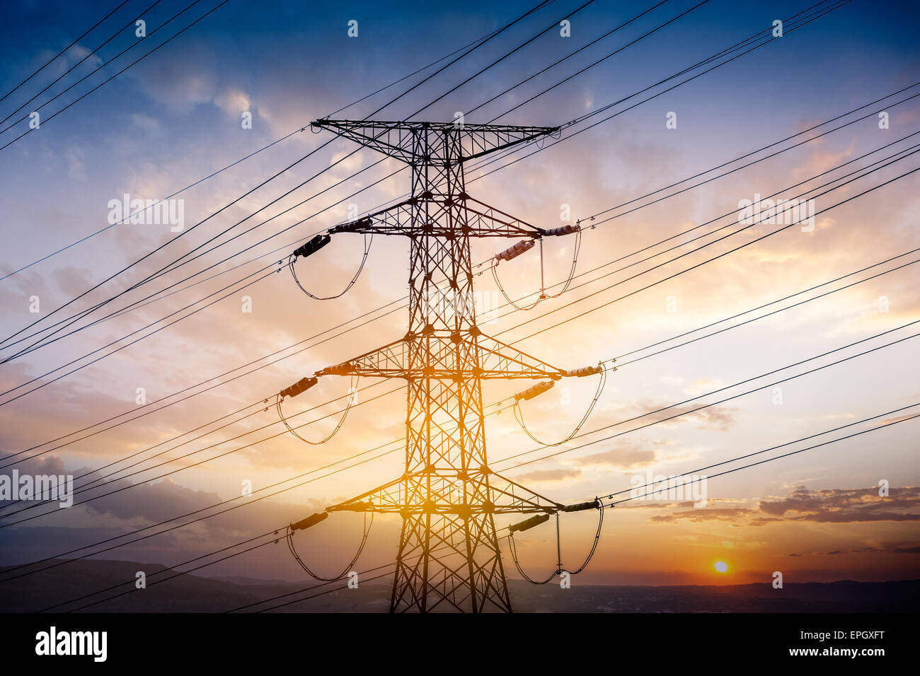 High voltage towers at sunset Stock Photo - Alamy