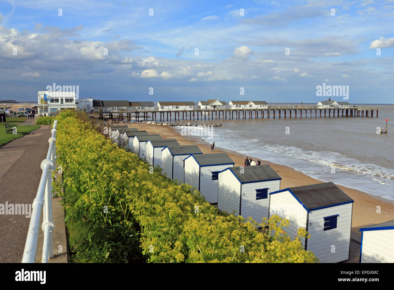 The pier and beach huts at Southwold, Suffolk, England, UK Stock Photo