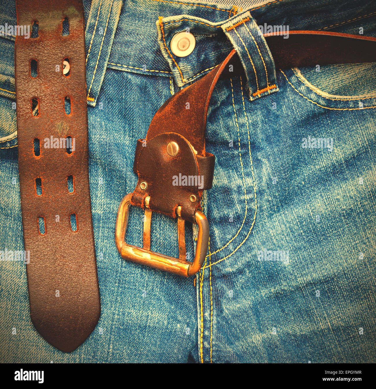 aged jeans with unfastened belt Stock Photo - Alamy