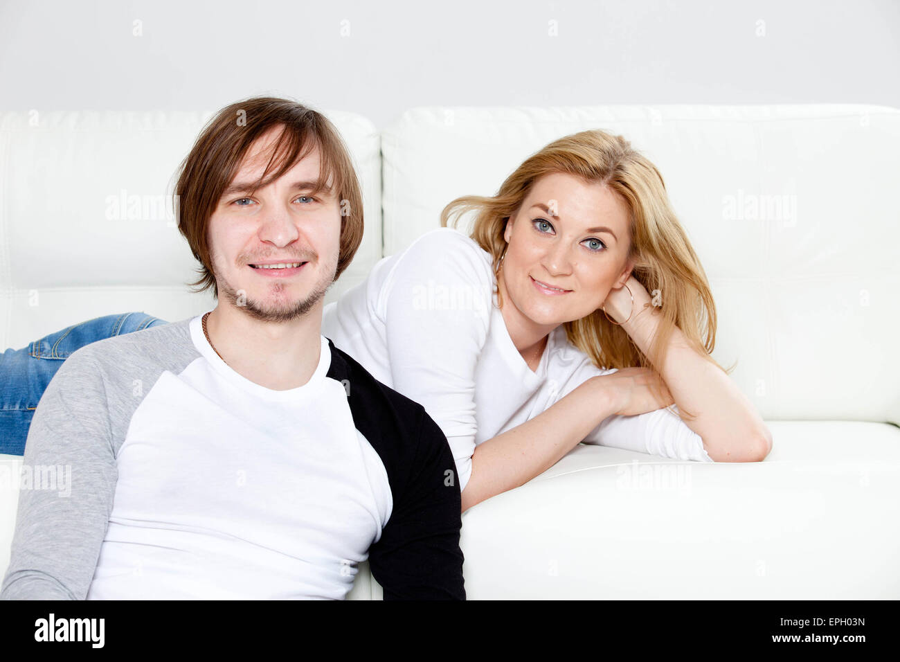 Couple sitting in home hi-res stock photography and images - Alamy