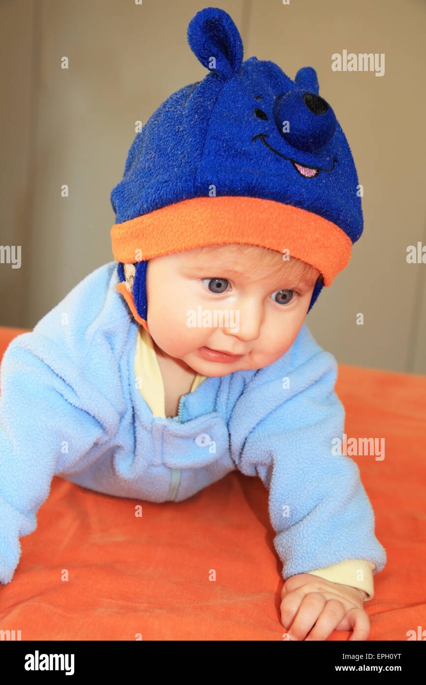 The four-months boy in a blue hat Stock Photo