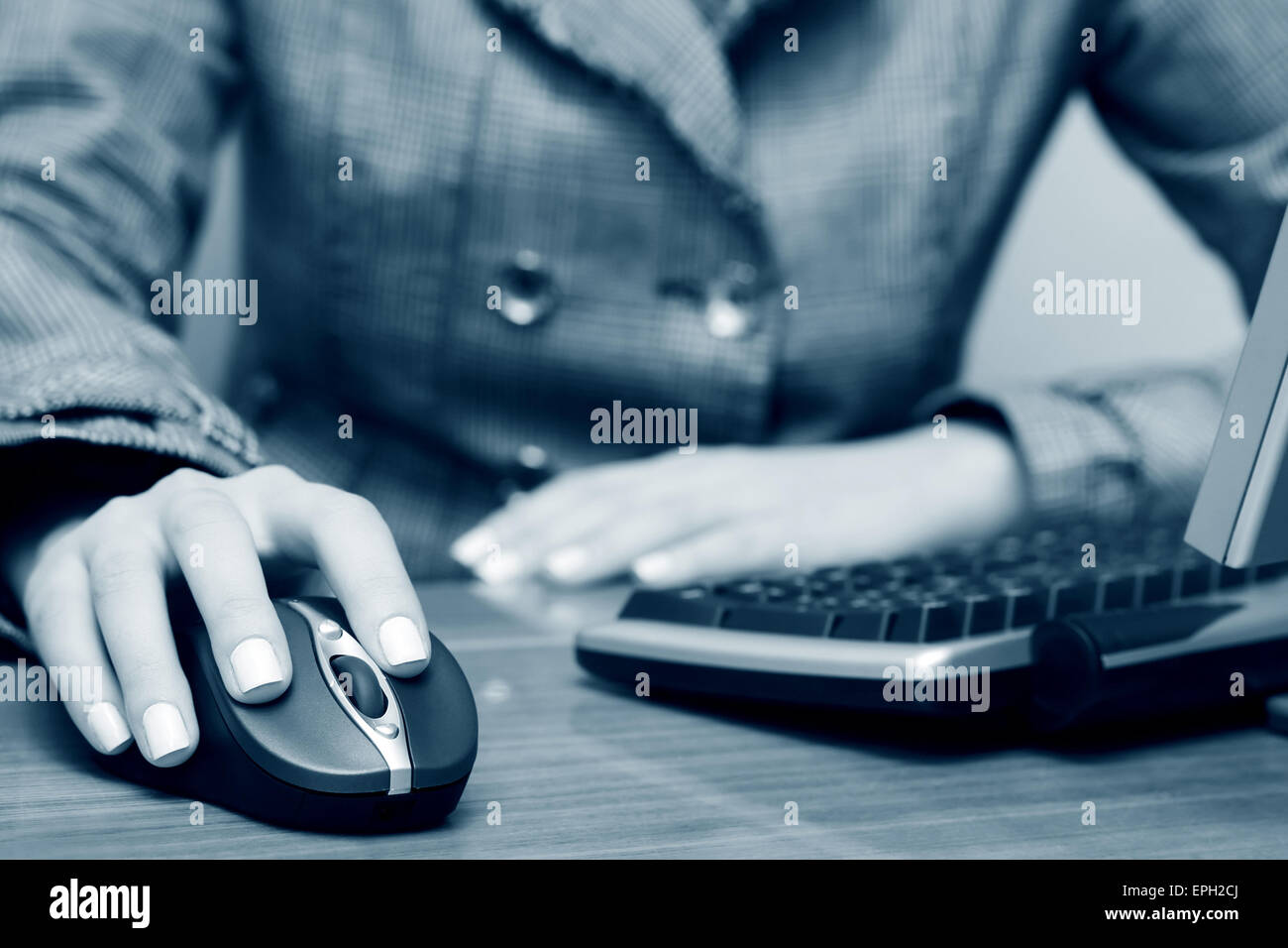 Female hand using computer mouse and keyboard Stock Photo - Alamy