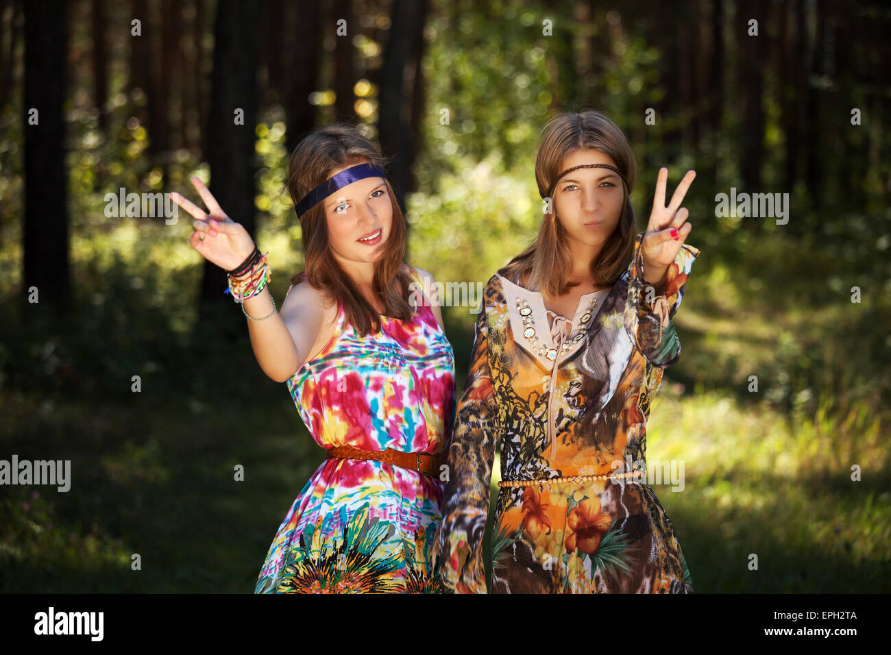 Two happy young girls in a summer forest Stock Photo - Alamy