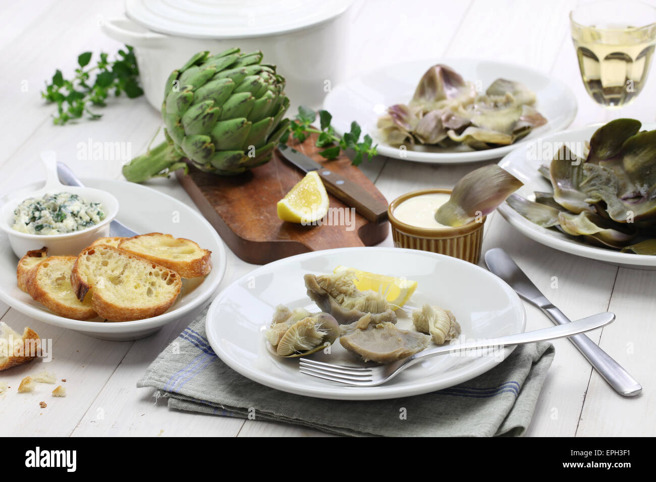 eating boiled artichoke, italian cuisine Stock Photo Alamy