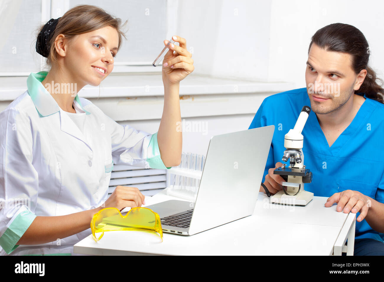 two scientists develop a new remedy Stock Photo