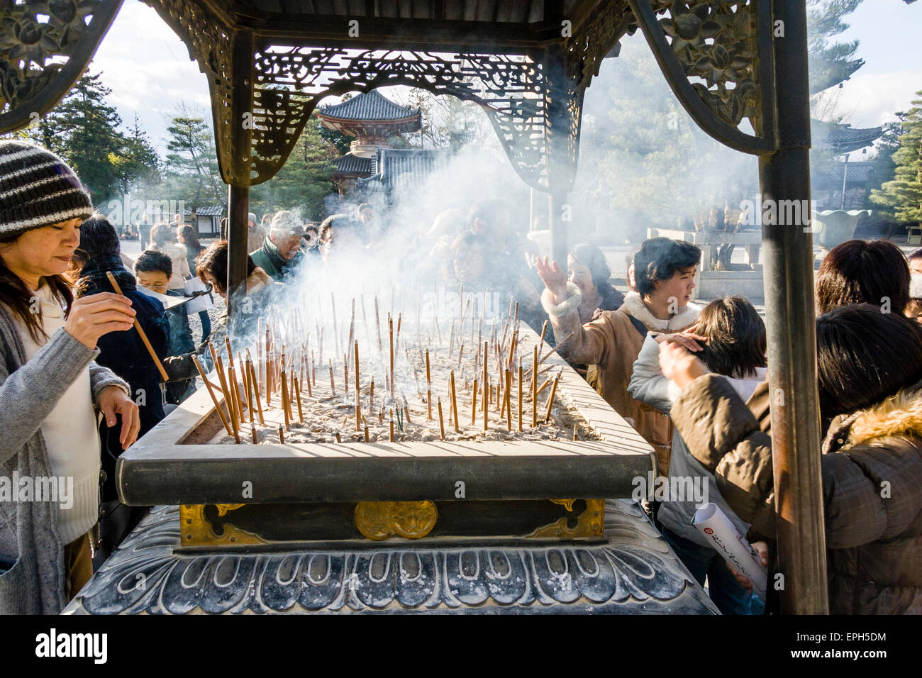Chionin temple in Kyoto. People standing around incense burner praying