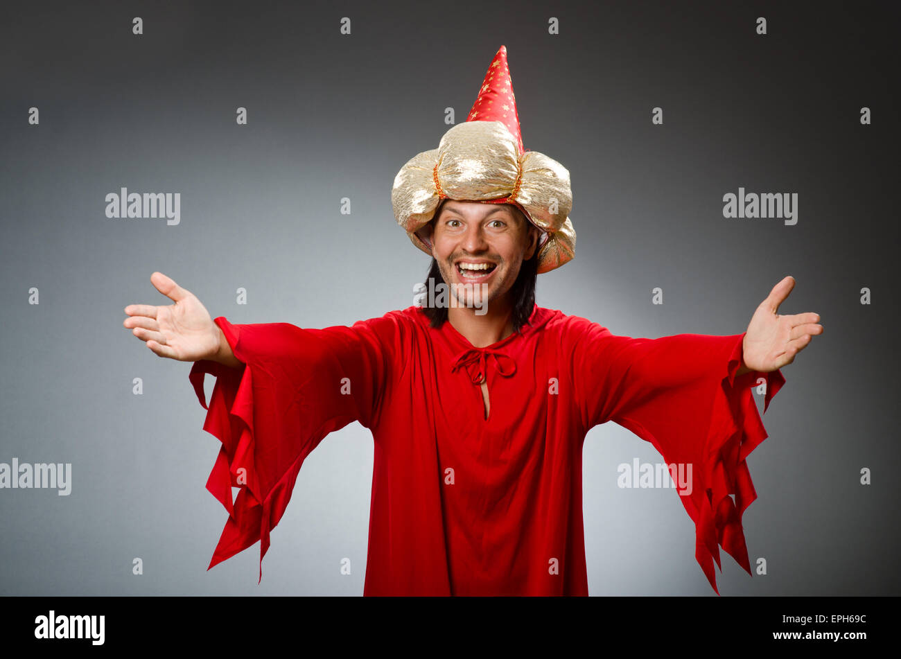 Funny wizard wearing red dress Stock Photo - Alamy