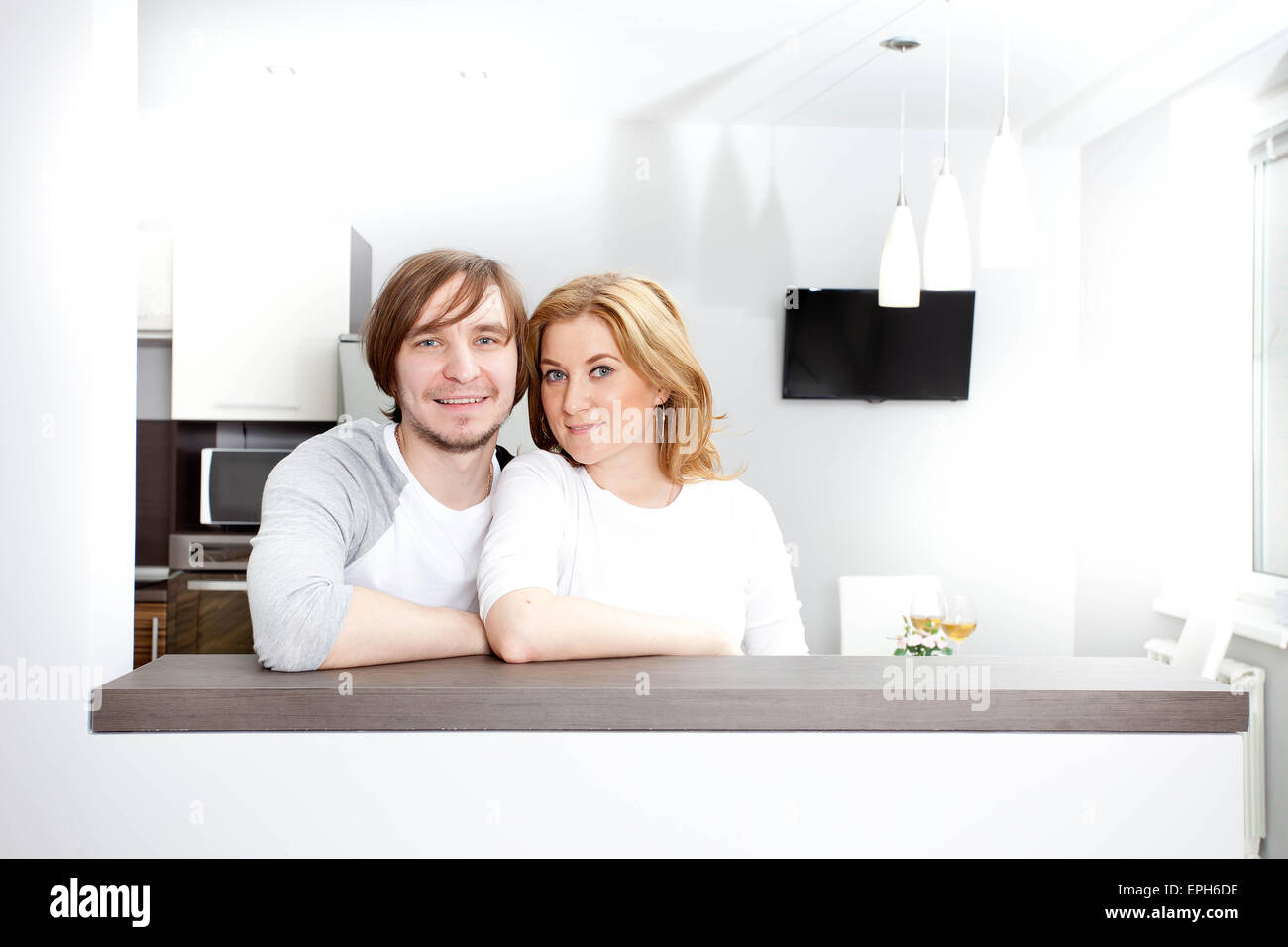 Happy Couple In New Home Stock Photo - Alamy