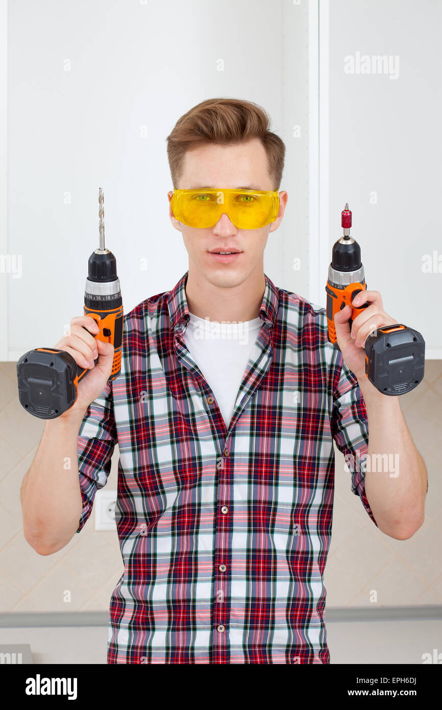 master with screwdriver and drill Stock Photo - Alamy